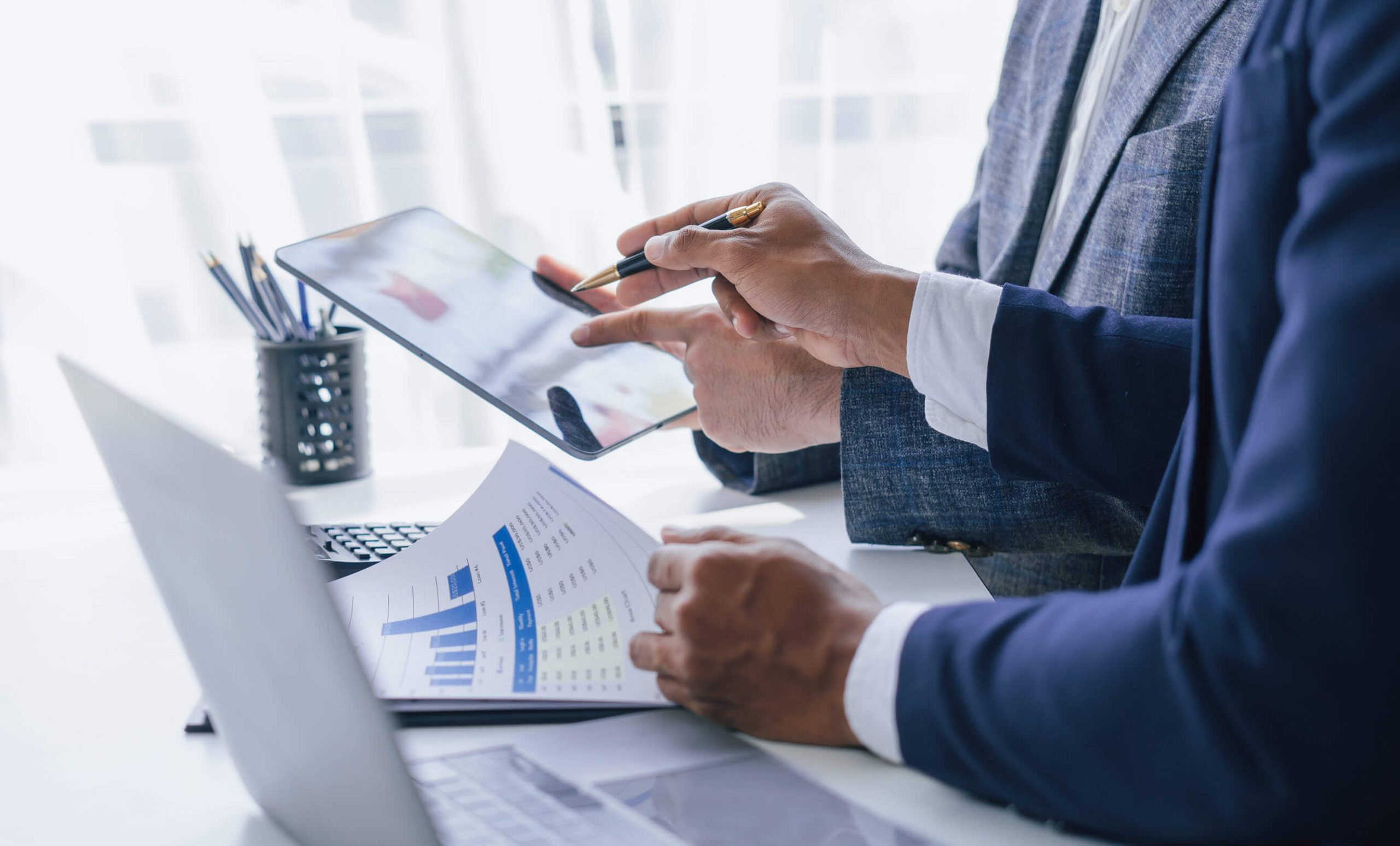 Business owners reviewing solar energy storage FEOC content